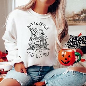 Never Trust The Living Sweatshirt